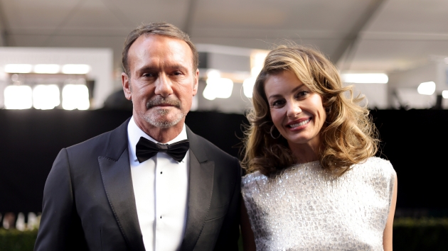 Getty timmcgrawfaithhillsuitandwhitedress